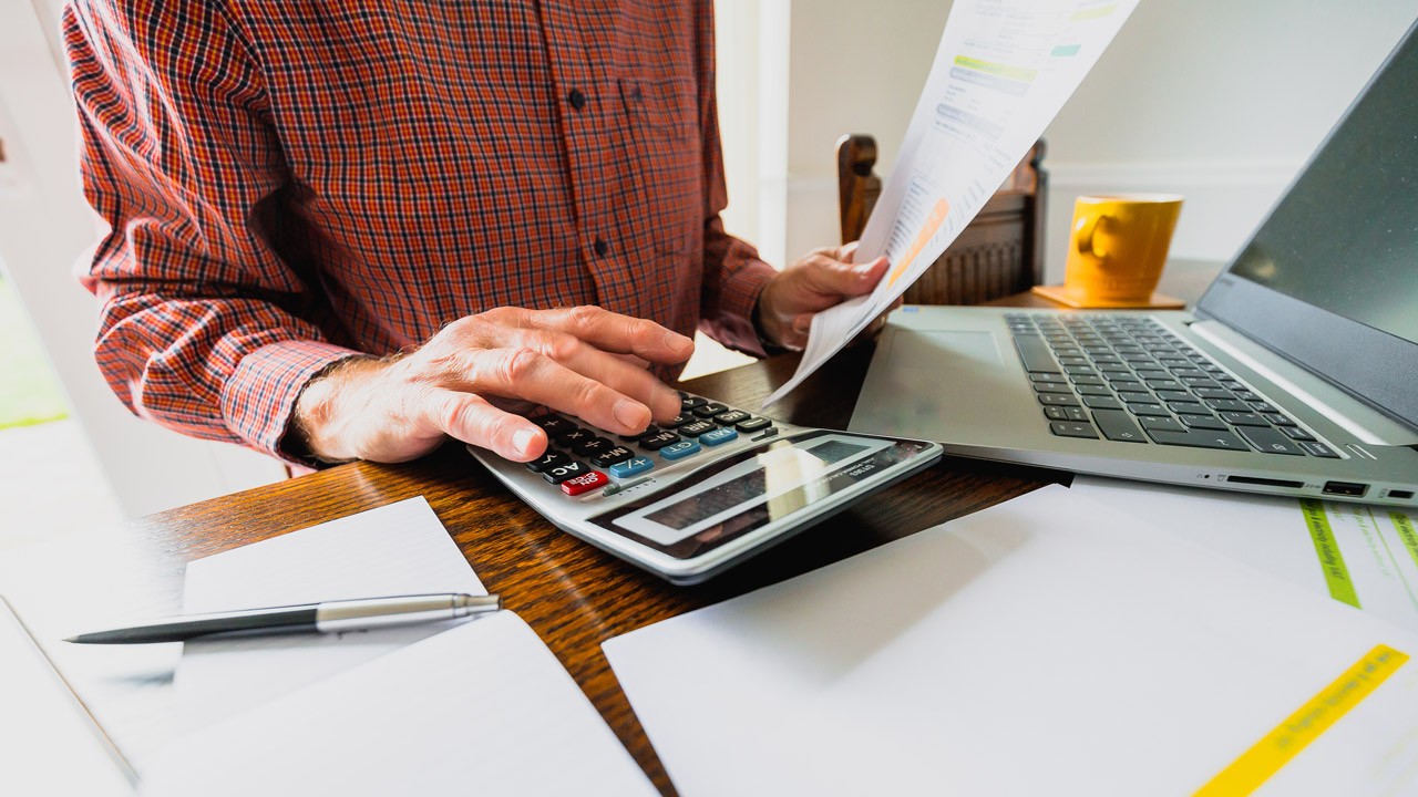 man checking bills