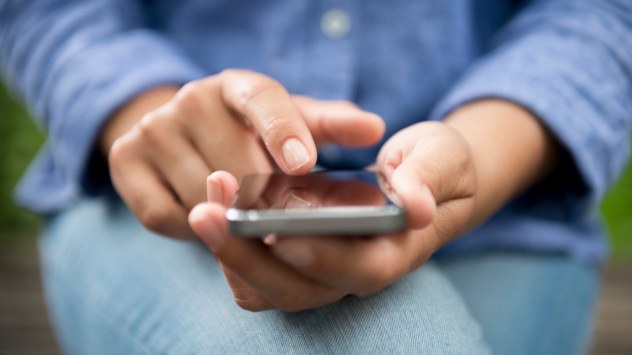 woman playing with the phone