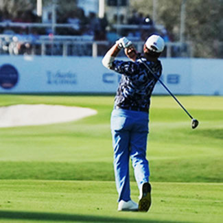 golfer swinging mid shot