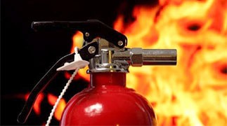 Fire extinguisher controls a fire in a business facility