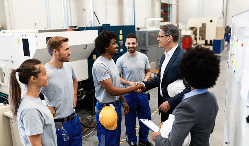 shaking hands at factory