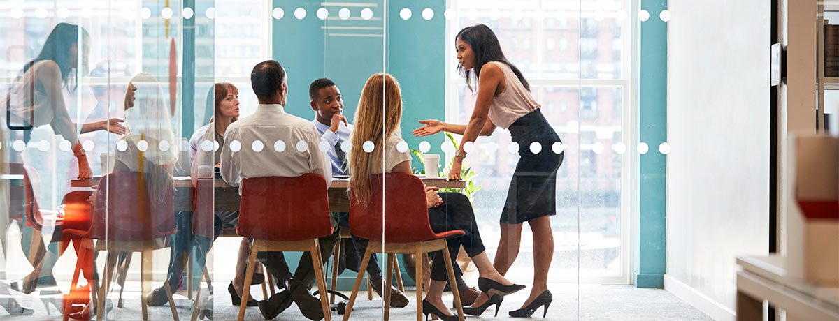 office colleagues meeting in boardroom 