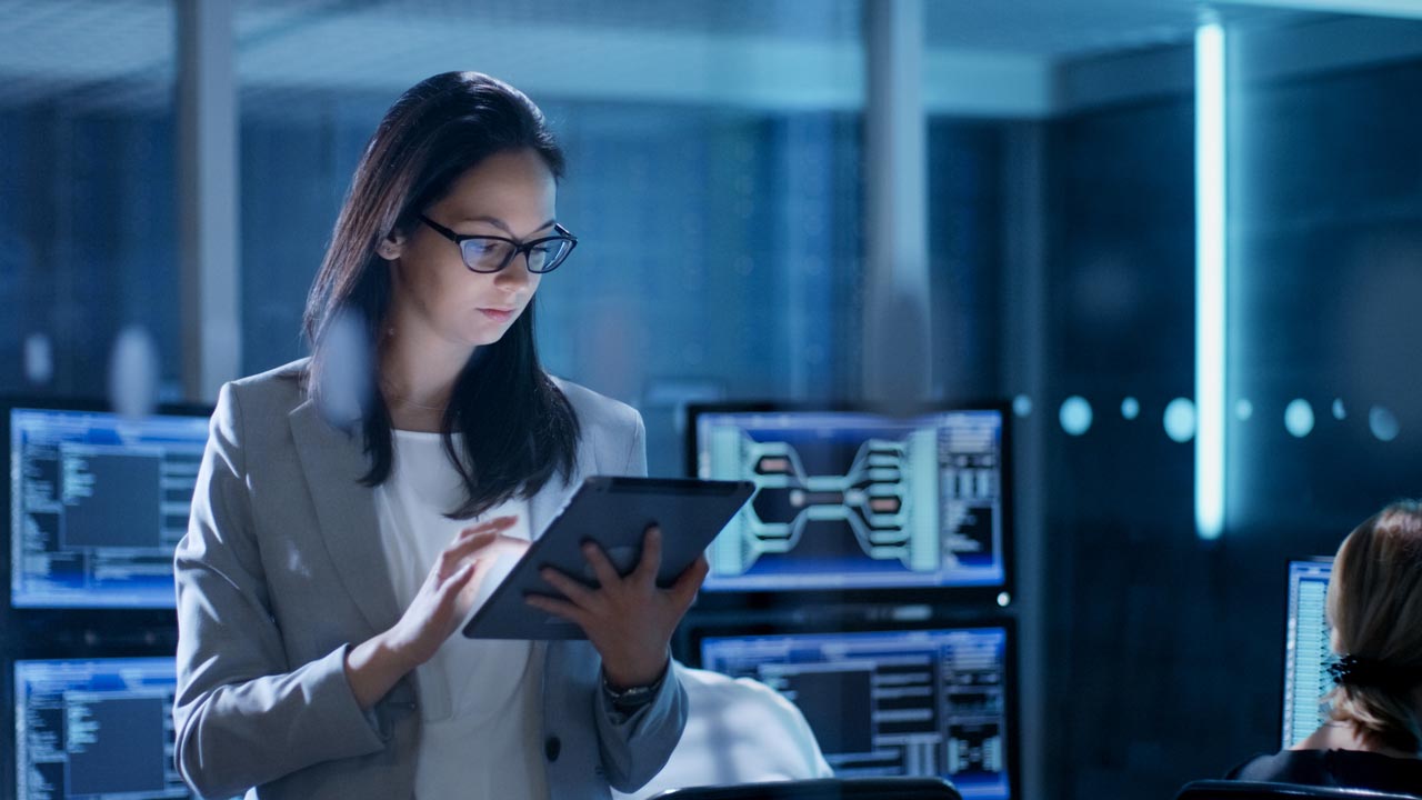 woman using tablet in control center