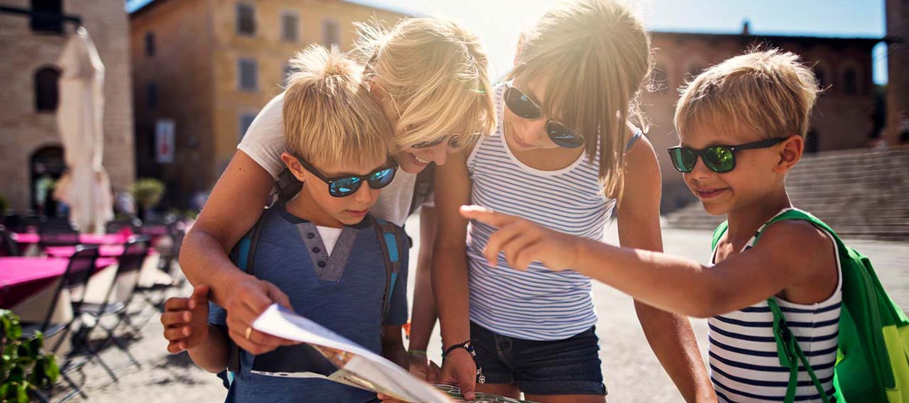 family checking a travel map during a trip