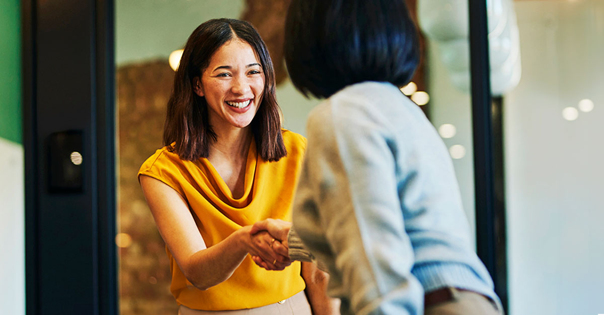 women shaking hands