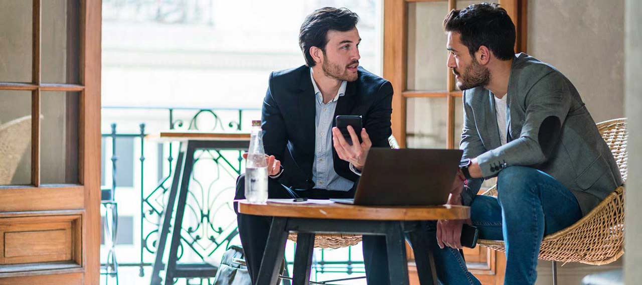 two men discussing business