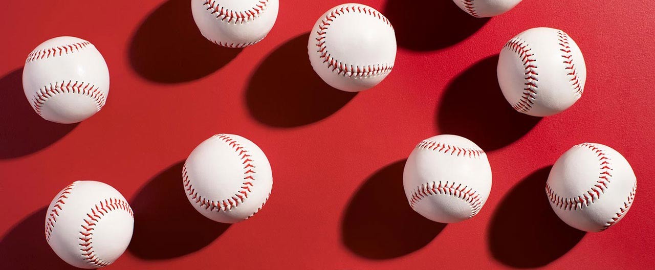 baseballs on red floor